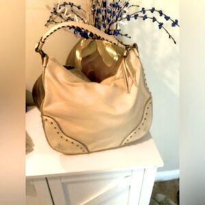 Like New Beautiful Michael Kors light yellow purse with bronze beads. Used once.